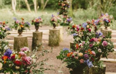 flowers at the ends of benches in the ceremony area at the woods at oakley