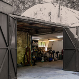 A large nissen hut now being used as a car repair workshop