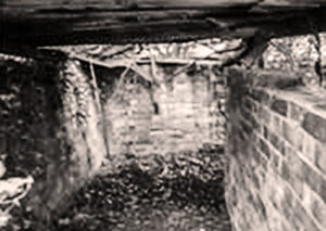A black and white photo of a blast shelter from world war 2